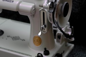 Violet satin ghost pearl close up sewing machine